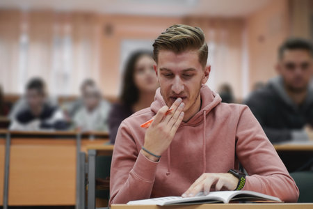 student taking notes while studying in high school