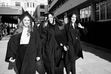 Group of diverse international graduating students celebratingの写真素材