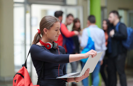 famel student with modern technology in school