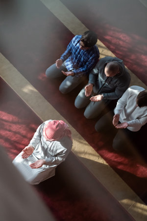 group of muslim people praying namaz in mosque.
