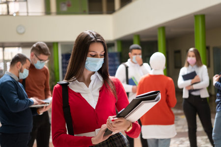 Portrait of multiethnic students group at university wearing protective face mask