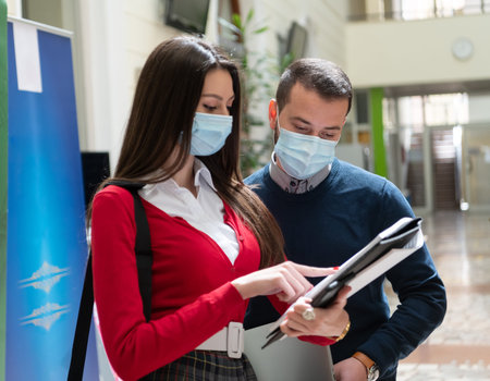 Portrait of multiethnic students group at university wearing protective face mask