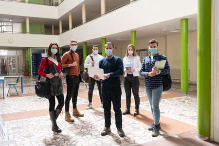 Multiethnic students group wearing protective face maskの写真素材