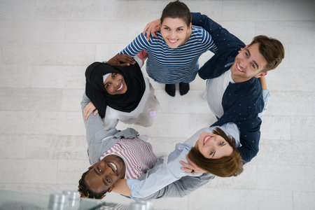 top view of diverse group of people standing embracing and symbolizing togetherness
