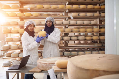 business woman team in local cheese production companyの写真素材