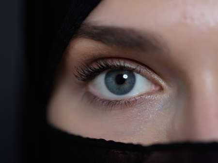 Portrait of muslim woman wearing niqab and traditional arabic clothes or abayaの写真素材