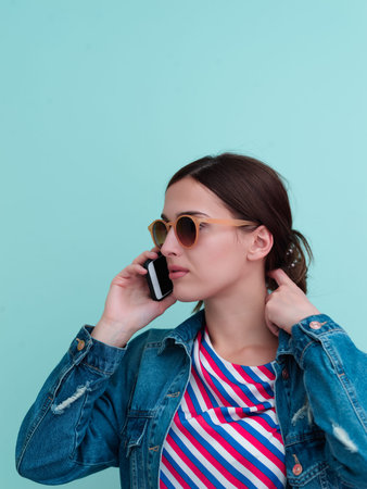 Portrait of young girl talking on the phone