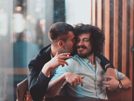 Portrait of multiethnic diverse gay LGBT romantic male couple embracing and showing their loveの写真素材