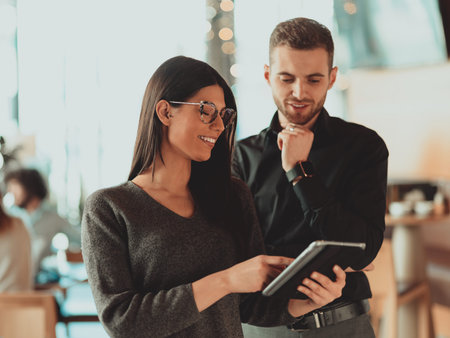 two businessmen posing decisively in the officeの写真素材