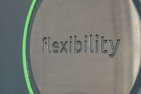 Engraving a cnc machine on a piece of metal. Engraving flexibility textの写真素材