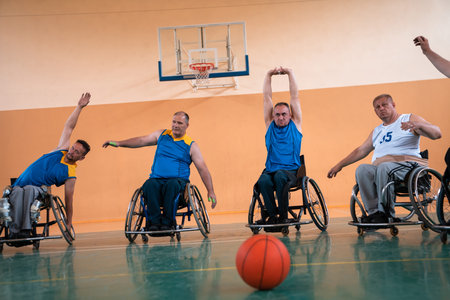 a photo of basketball teams with disabilities with the selector in the big hall before the start of...