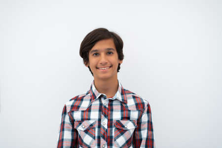 a portrait of a young attractive Arab boy isolated on a white backgroundの写真素材