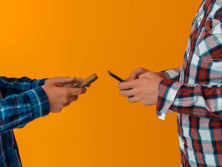 Arab teenagers group using smart phones for social media networking and sharing of informations for online education. Selective focusの写真素材