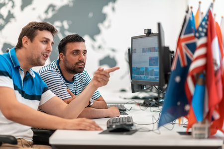 Group of Casual business man working on desktop computer in modern open plan startup office...
