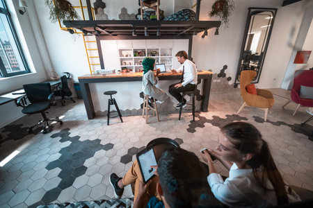 Group of casual multiethnic business people taking break from the work doing different things while...