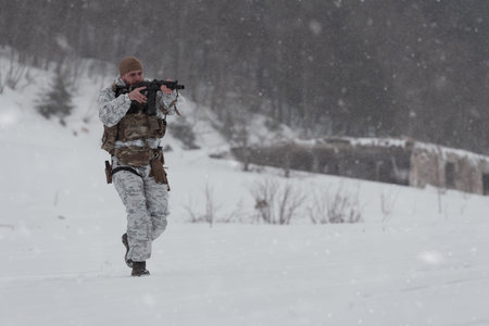 Soldier in winter camouflaged uniform in Modern warfare army on a snow day on forest battlefield...