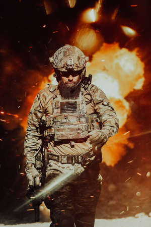 A bearded soldier in a special forces uniform walks through an abandoned building after a successful mission. Selection focusの写真素材