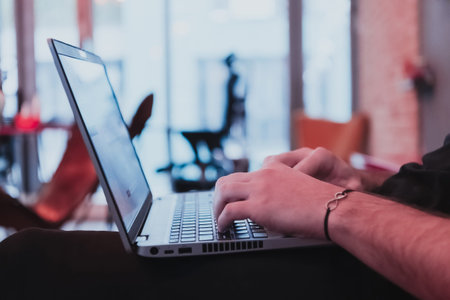 Close-up Of A Mans Hand Working On Laptop. Selective Focus