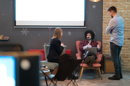 Successful team. Group of young business people working and communicating together in creative...