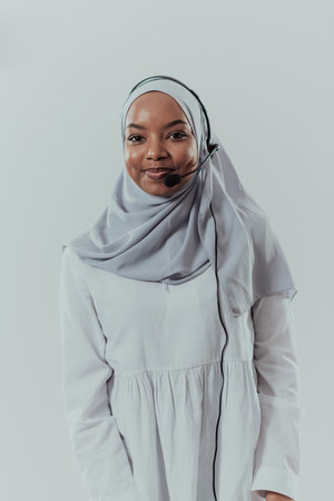African muslim female with hijab scarf customer representative business woman with phone headset...