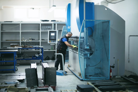 A smart factory worker or engineer makes machines in a production workshop. The concept of industry...