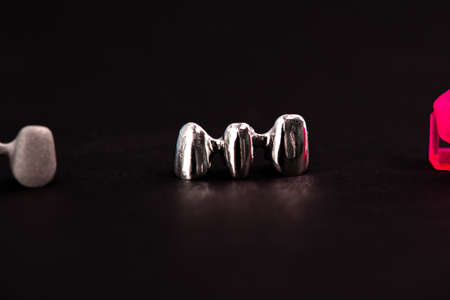 Teeth implant and crown installation process parts isolated on a black background. Medically accurate 3D model.の写真素材