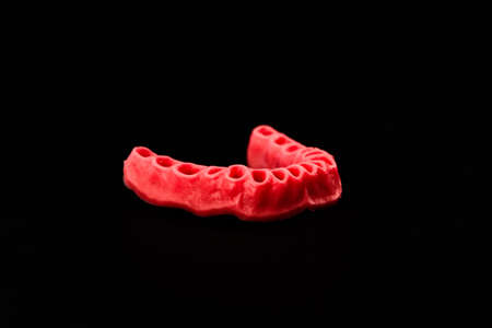 human gums without teeth model medical implant isolated on black background. Healthy teeth, dental care and orthodontic concept.の写真素材