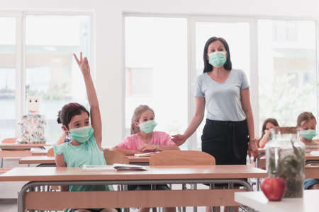 Preschool education. Students at school play interesting games with the teacher for the purpose of educationの写真素材