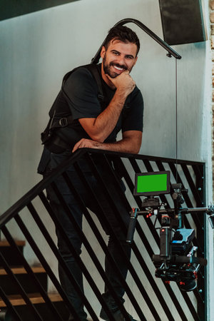Cameraman working on professional camera taking stock footage