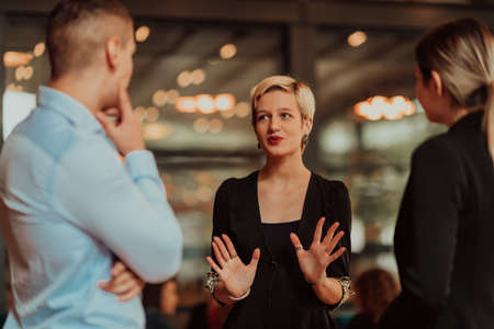 Photo of a business team of young people discussing business ideas in a modern urban environment. Selective focusの写真素材