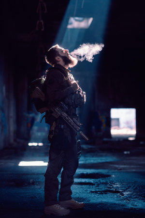 Army soldier in Combat Uniforms with an assault rifle and combat helmet night mission dark background. Blue and purple gel light effect.の写真素材