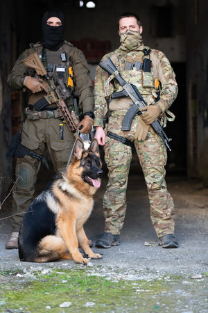 Modern Warfare Soldiers with military working dog in action on the battlefield.の写真素材