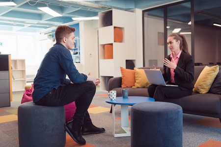 Multiethnic startup business team on meeting in a modern bright open space coworking office....