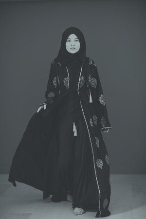 Black white photo of beautiful muslim woman in fashinable dress with hijabの写真素材