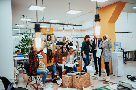 Group of business people throwing paper in air at modern startup office, team success and job done conceptの写真素材