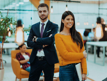 The boss of the company talking to his employee while she showing him the final report on the laptopの写真素材