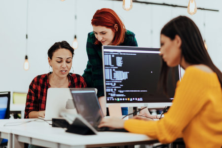 Multiethnic group of employees working in a marketing company. A group of colleagues is working on a...