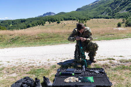 Special operations soldiers team preparing tactical and communication gear for action battle. Long...