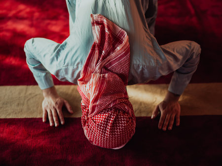 A Muslim praying in a modern mosque during the holy Muslim month of Ramadan