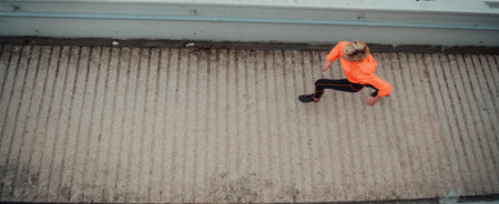 Top view photo of omen in sports clothes running in a modern urban environment. The concept of a...