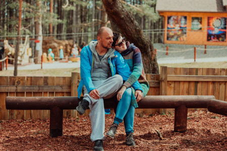 A romantic couple spending time in the park. A couple taking photo on a beautiful sunny day while...