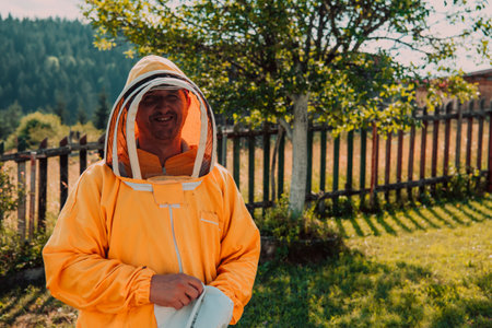 Beekeeper put on a protective beekeeping suit and preparing to enter the apiaryの写真素材