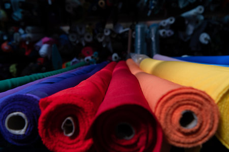 Interior of an industrial warehouse with fabric rolls samples. Small business textile colorful warehouse.の写真素材