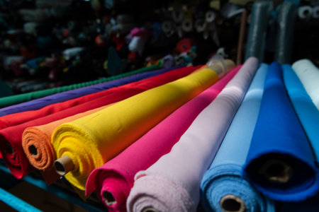 Interior of an industrial warehouse with fabric rolls samples. Small business textile colorful warehouse.の写真素材