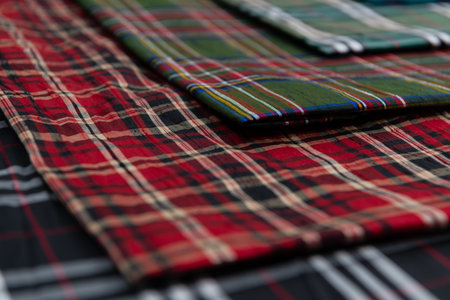 Collection of Scottish fashionable fabrics . Samples of different natural fabrics for sewing a fashion collection of clothes. Large selection of fabrics in the store or tailor warehouse.の写真素材