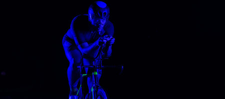 A triathlete rides his bike in the darkness of night, pushing himself to prepare for a marathon. The...