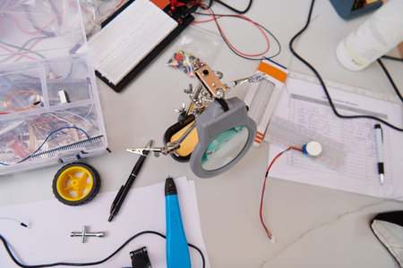 Various components and installations for robot fabrication fill the space, representing the...