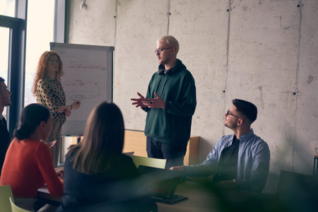 In a modern office setting, a group of business professionals attentively listens to a captivating...