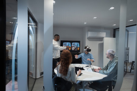 A diverse group of businessmen collaborates and tests a new virtual reality technology, wearing virtual glasses, showcasing innovation and creativity in their futuristic workspaceの写真素材