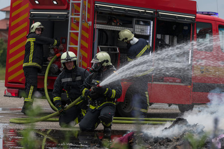 Firefighters fight the fire flame to control fire not to spreading out. Firefighter industrial and...